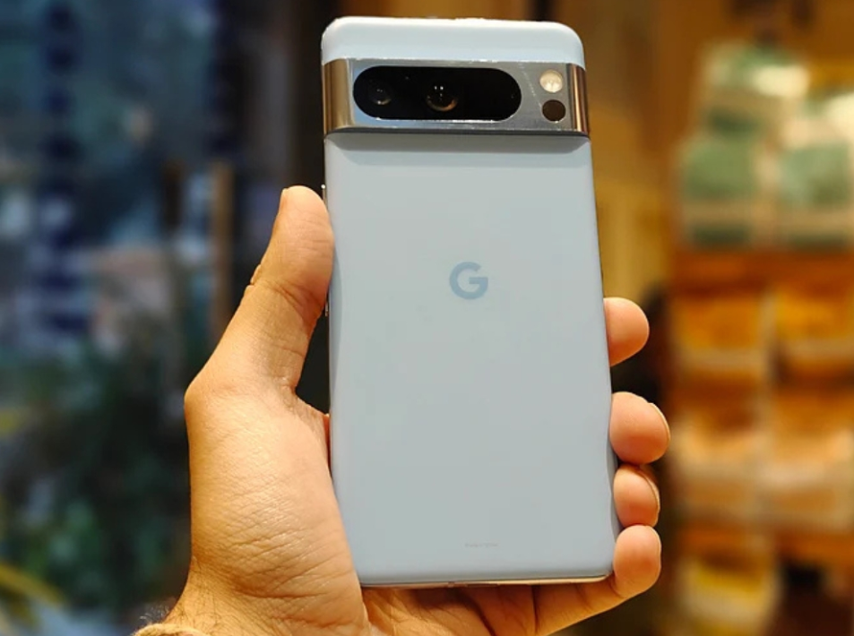 Someone's hand holding the G3 and its showing the backside of the mobile in light blue color. Google Pixel 8 Pro Price
