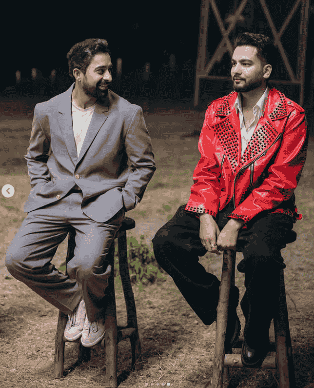 On Shooting Elvish Yadav and Runnvijay Singha looking each other while sitting on chair