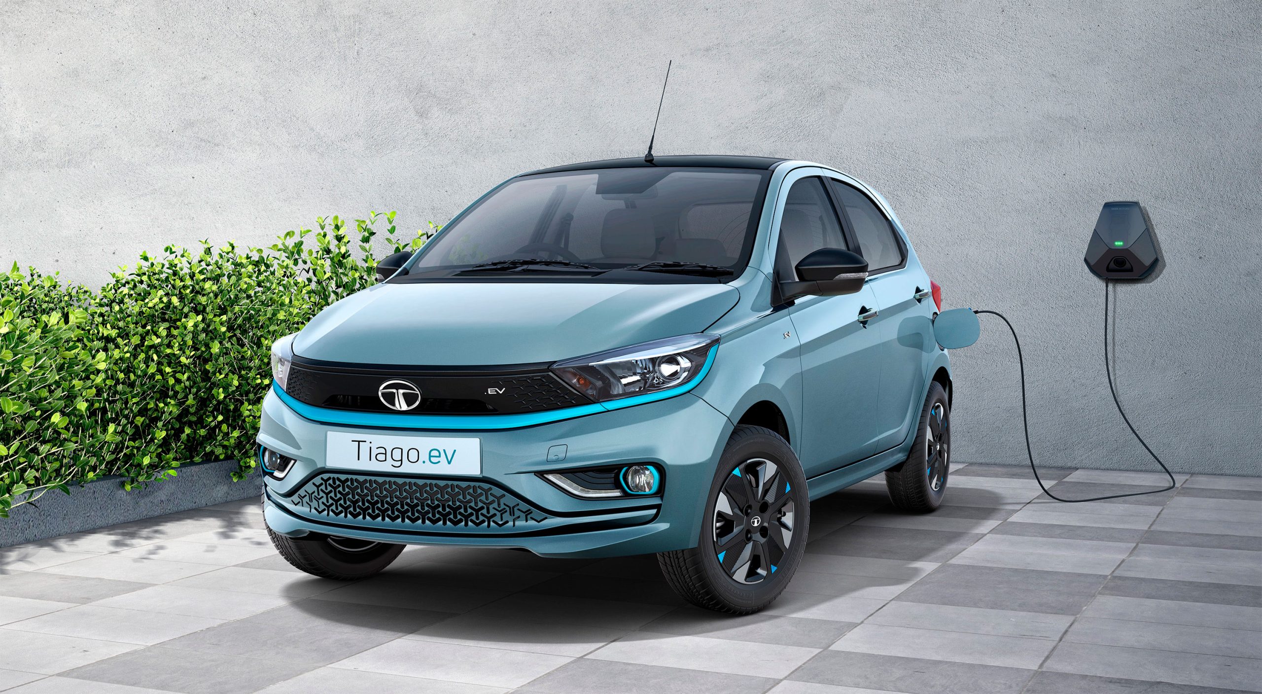 Tata Tiago EV charging at a station India's affordable electric hatchback