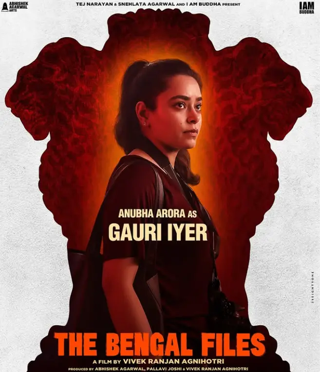 The Bengal File Gauri Iyer Standing In the front Indian Emblem in red color she's standing and looking something