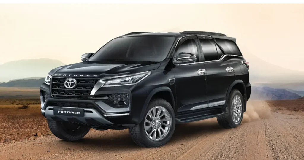 Toyota Fortuner Diesel Off road show drifting on hill area and mountains in the background